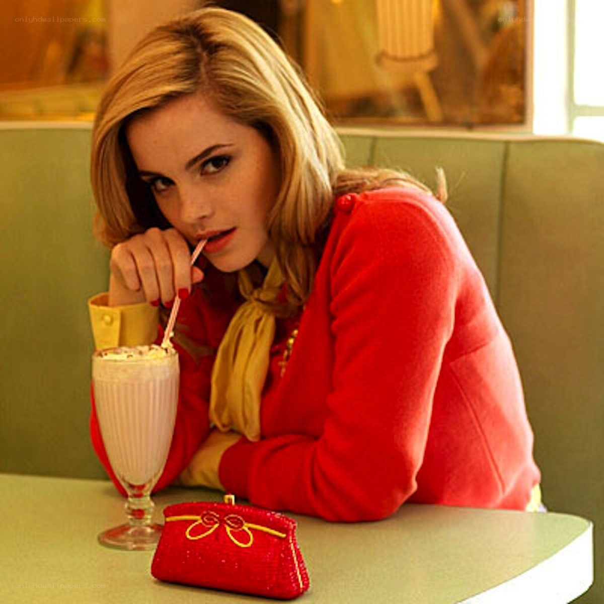 Woman with milkshake in diner