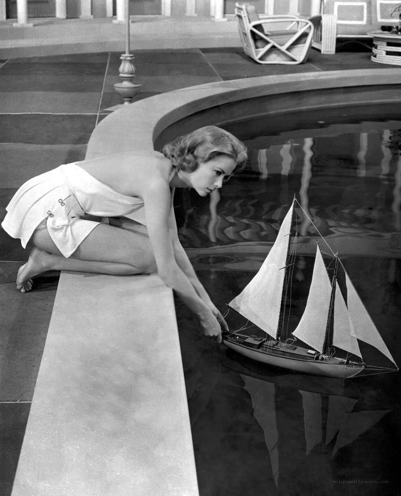 Woman with model sailboat