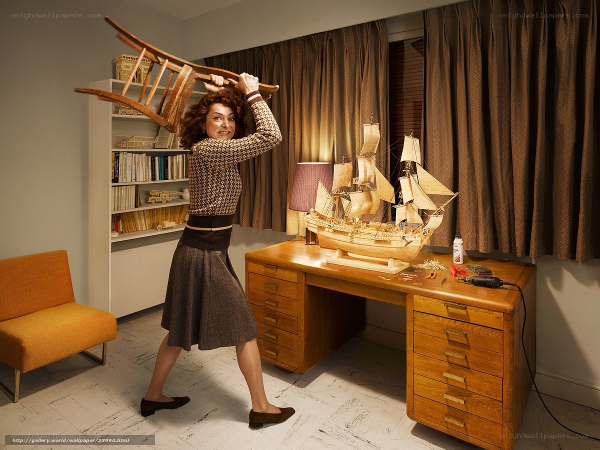 Woman with model ship and chair