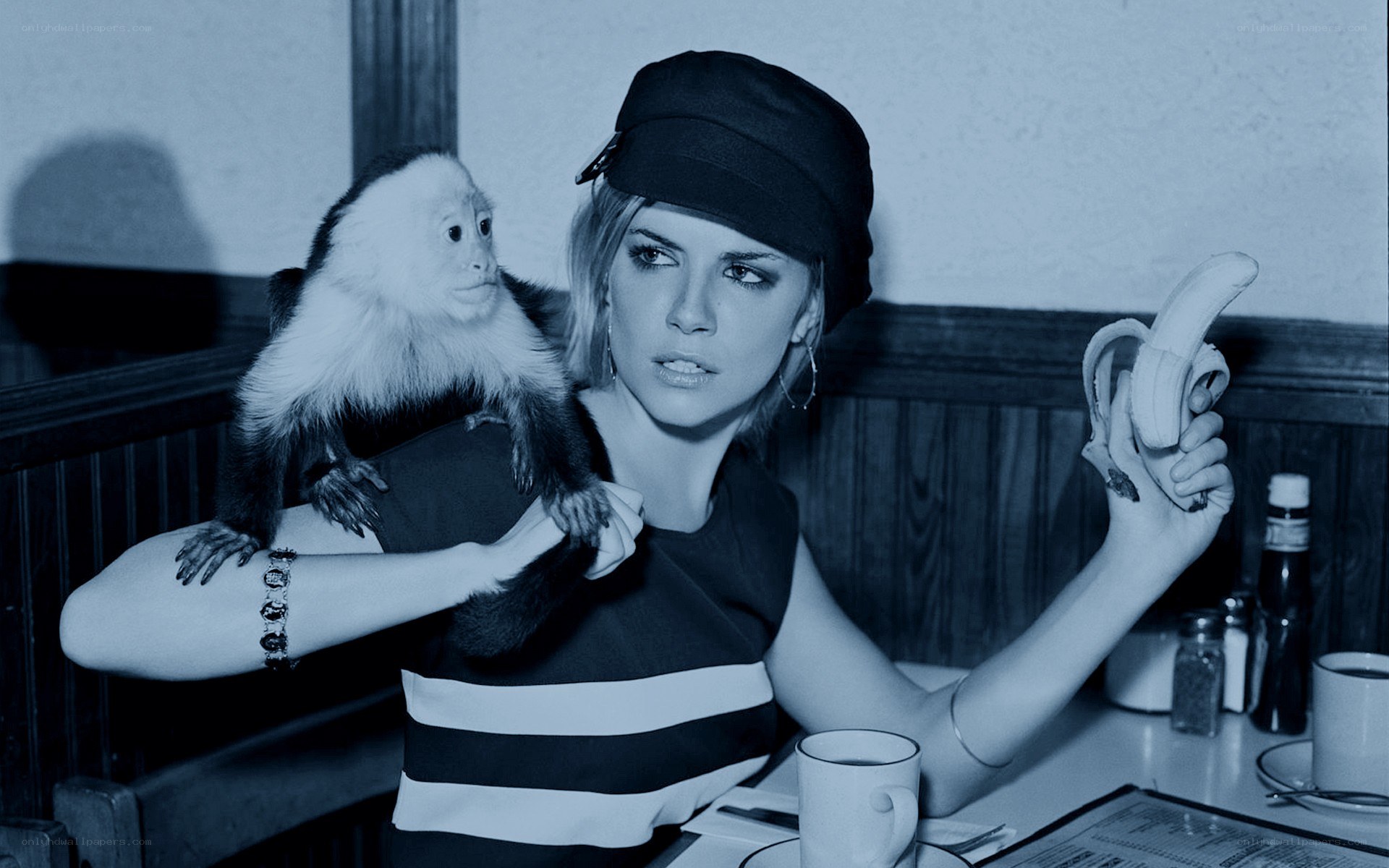 Woman with monkey at diner