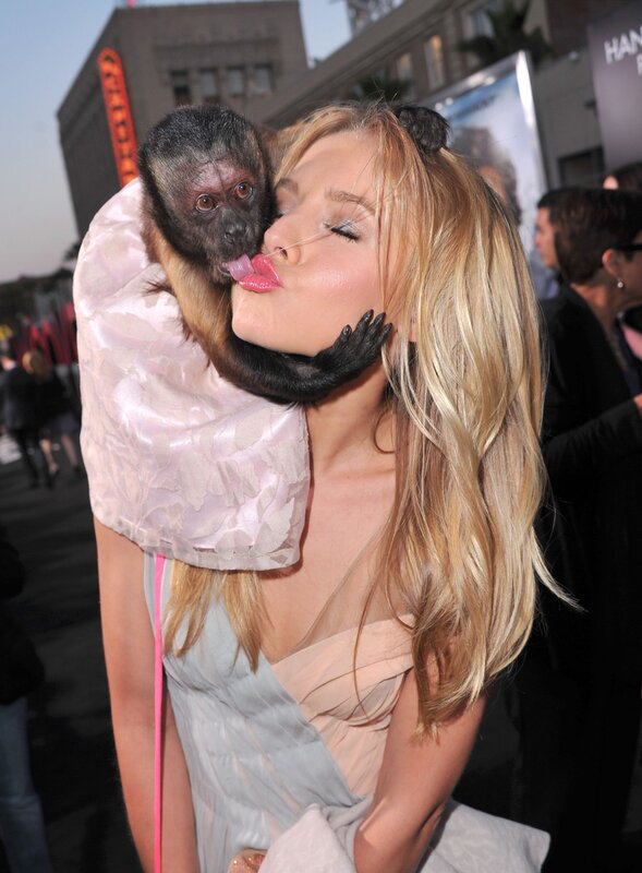 woman with monkey on shoulder