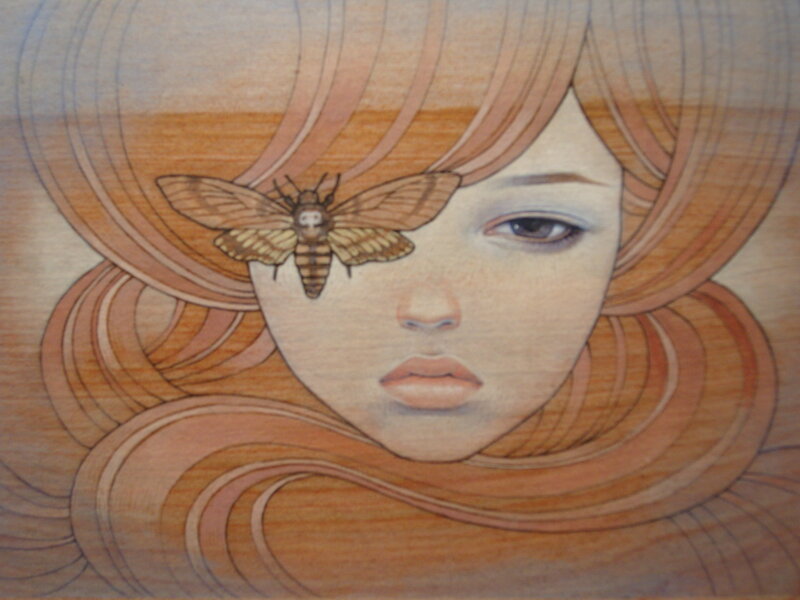 woman with moth on face