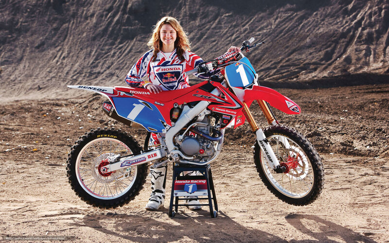 Woman with motocross bike
