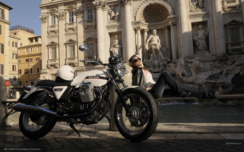 Woman with motorcycle at Trevi Fountain