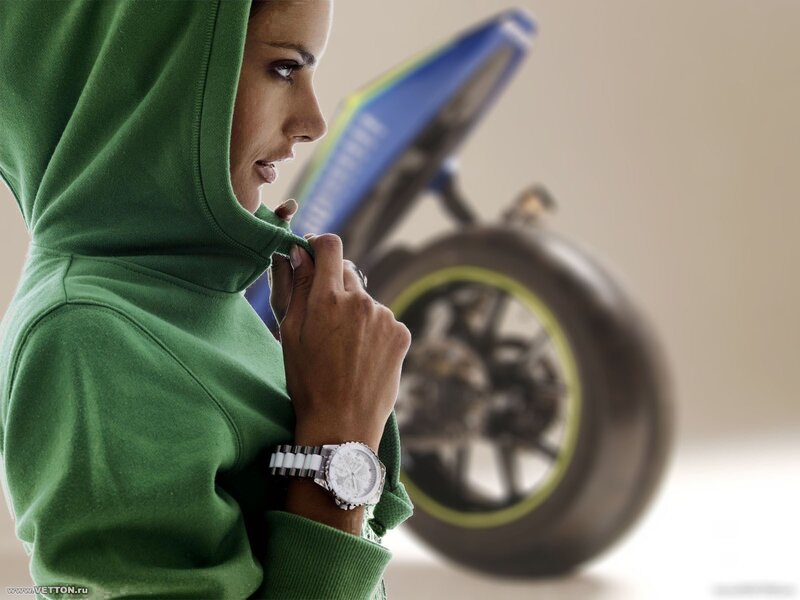 woman with motorcycle in background