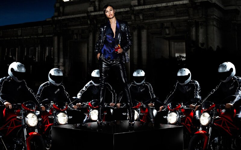 Woman with motorcyclists at night