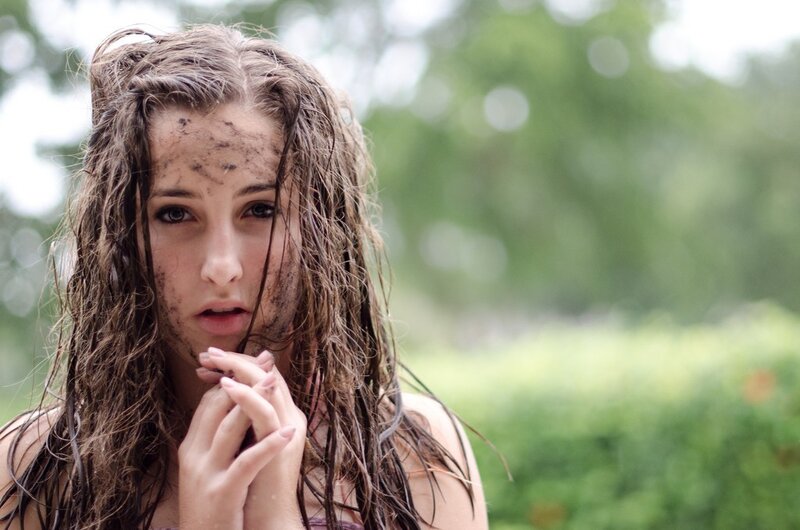 woman with muddy face