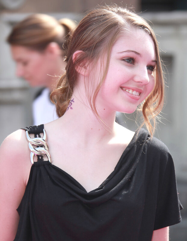 woman with neck tattoo smiling