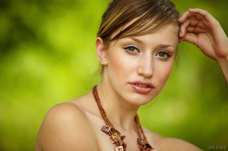 woman with necklace in nature