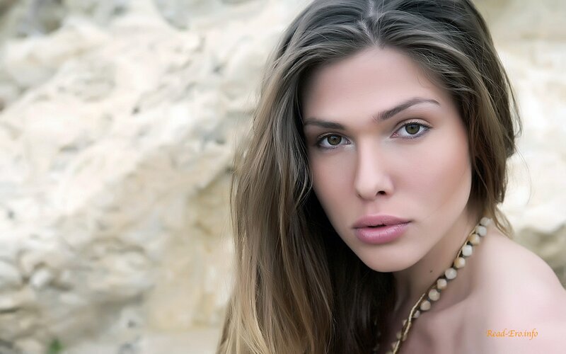 woman with necklace on rocky background