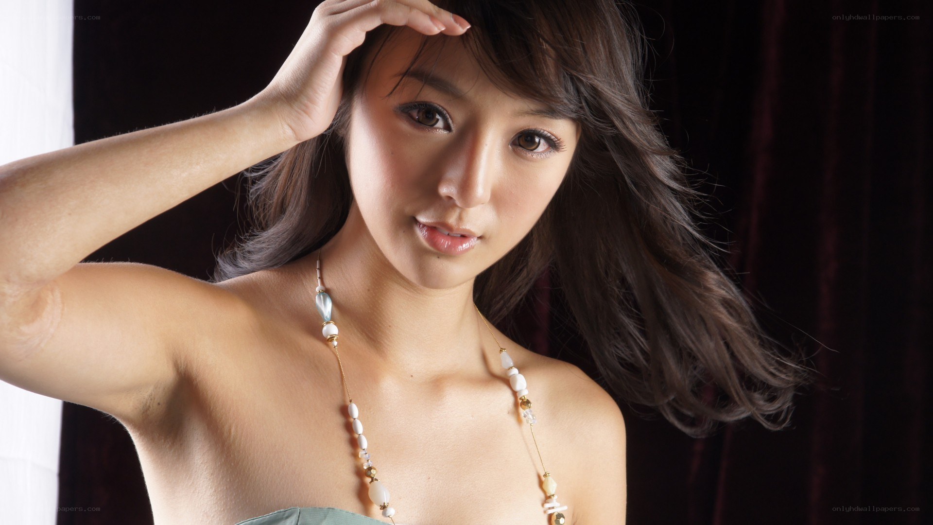 woman with necklace posing