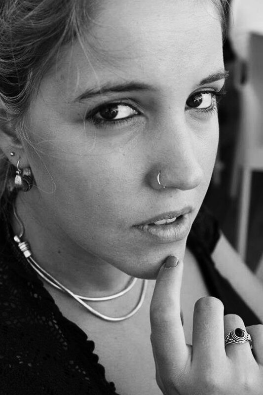 woman with nose ring and earrings