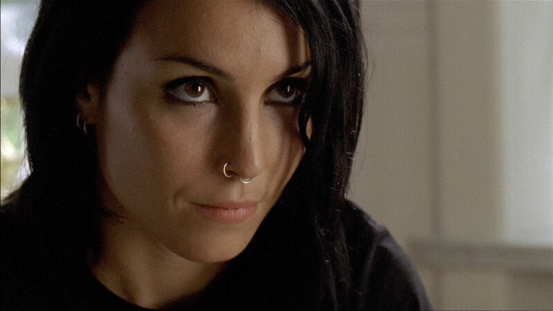woman with nose ring looking at camera