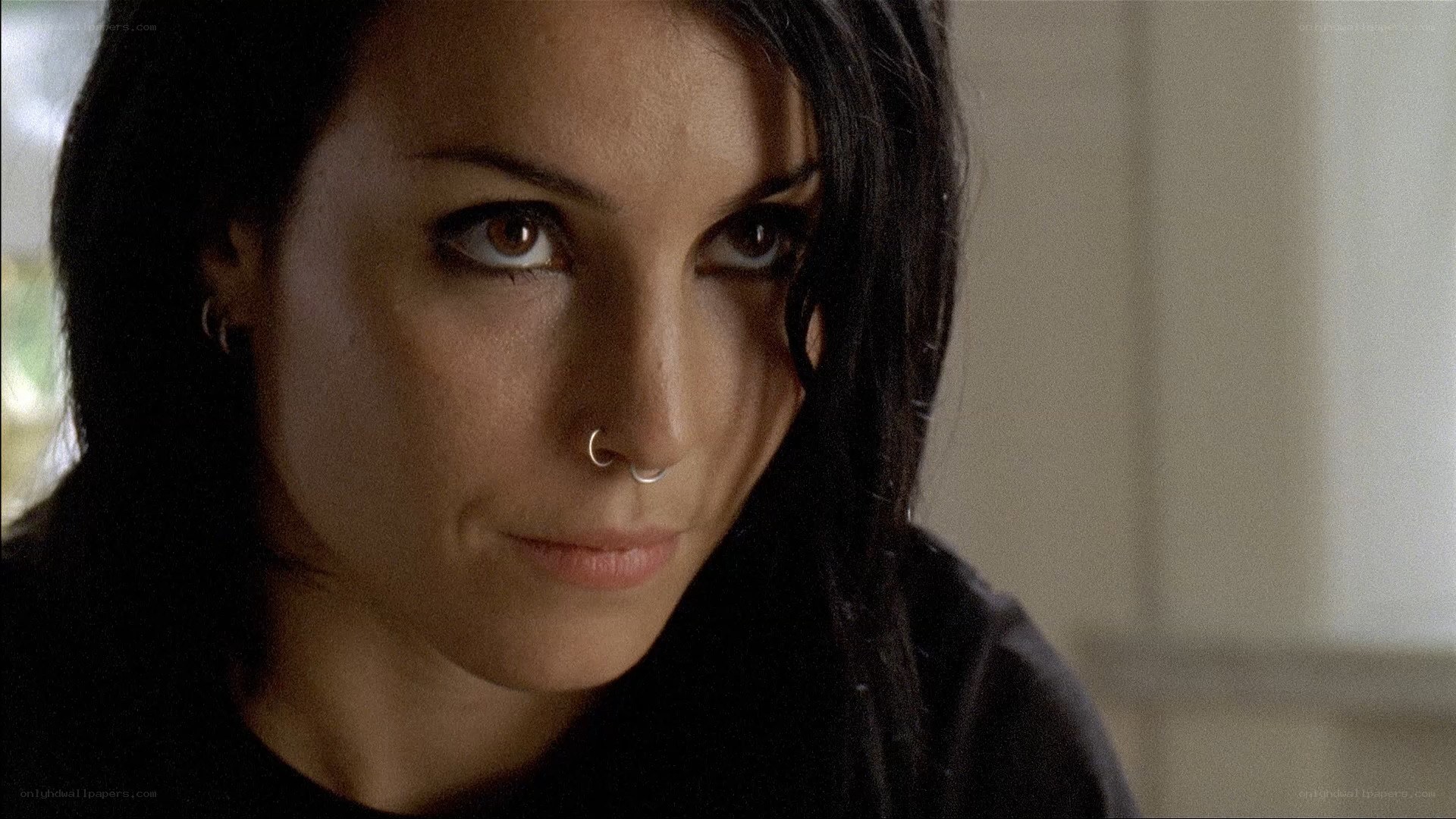 woman with nose ring looking at camera