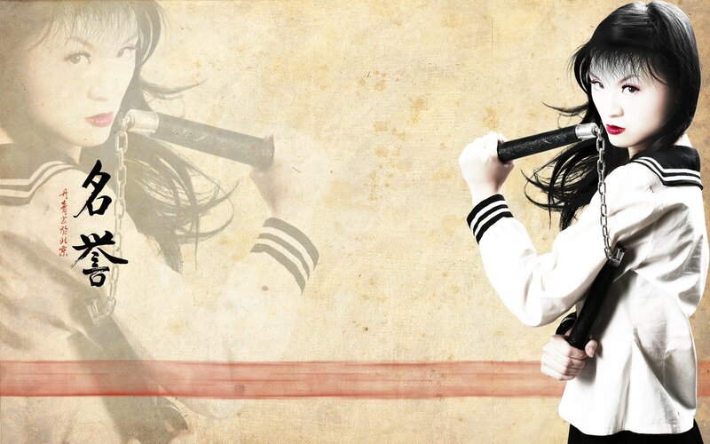 Woman with nunchaku in school uniform
