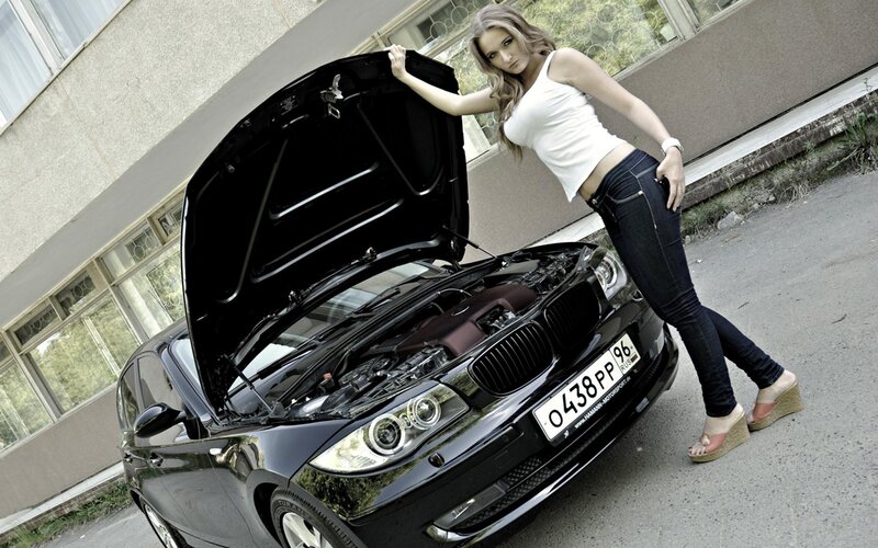 woman with open car hood