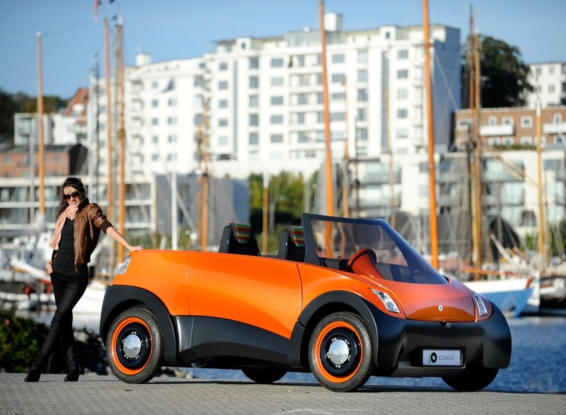 Woman with orange electric car