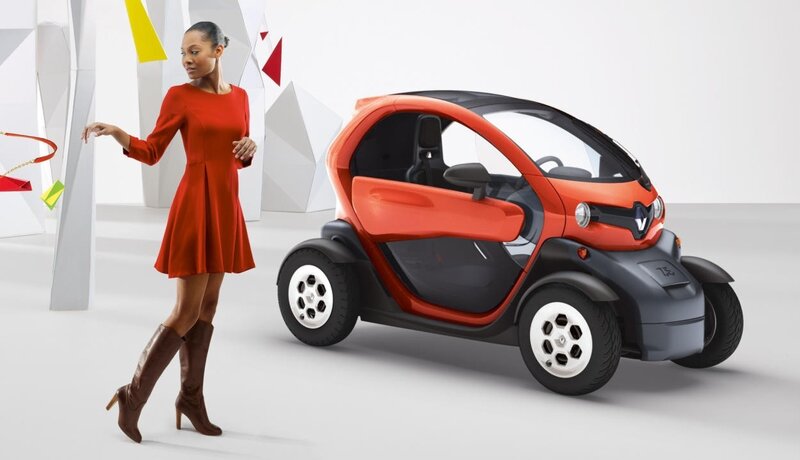 Woman with orange electric car