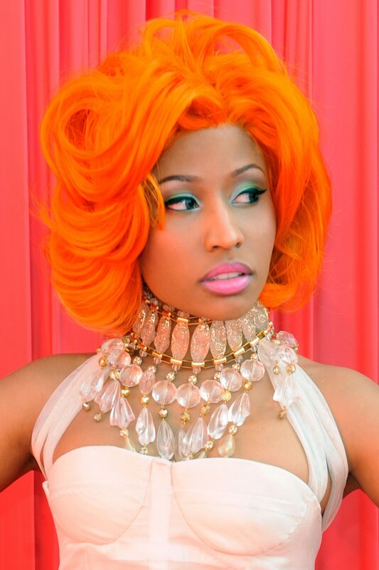 woman with orange hair and necklace