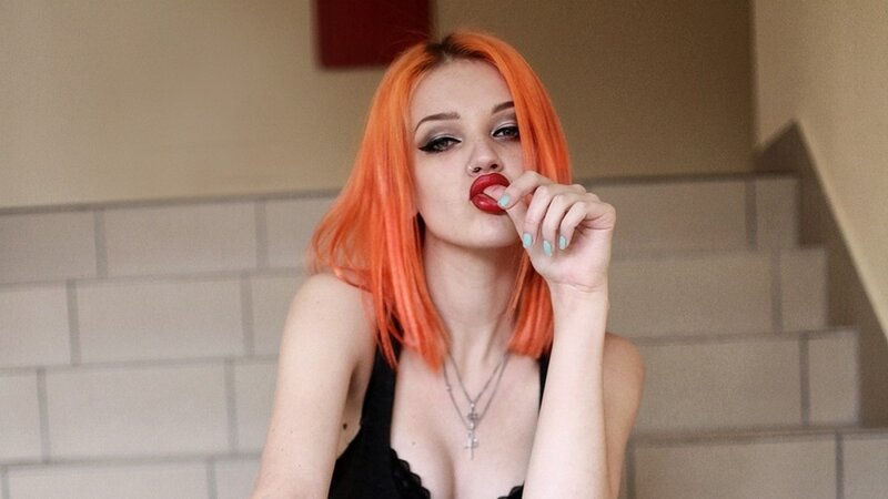 woman with orange hair posing