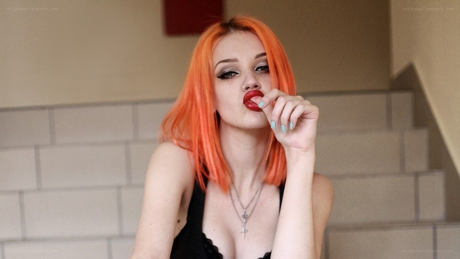 woman with orange hair posing