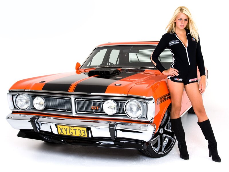 woman with orange muscle car