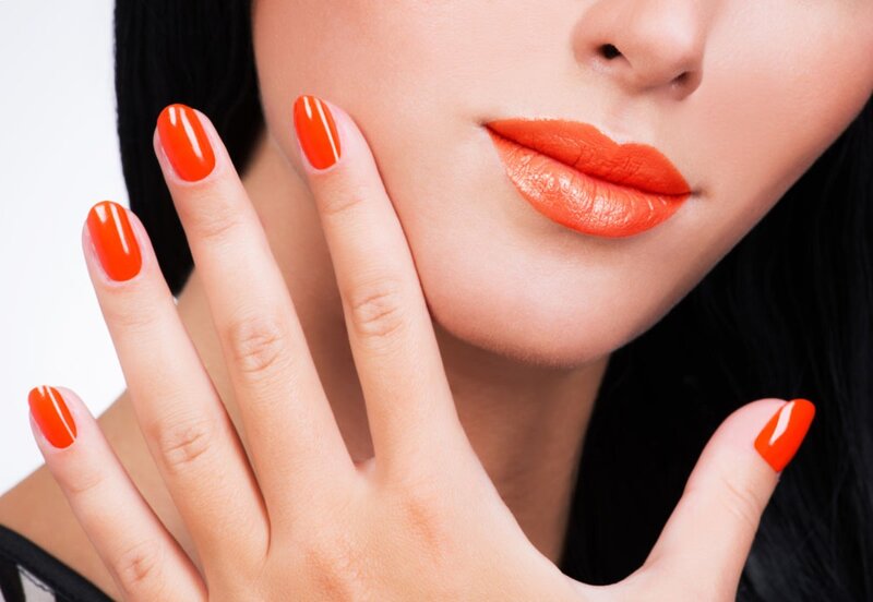Woman with Orange Nails