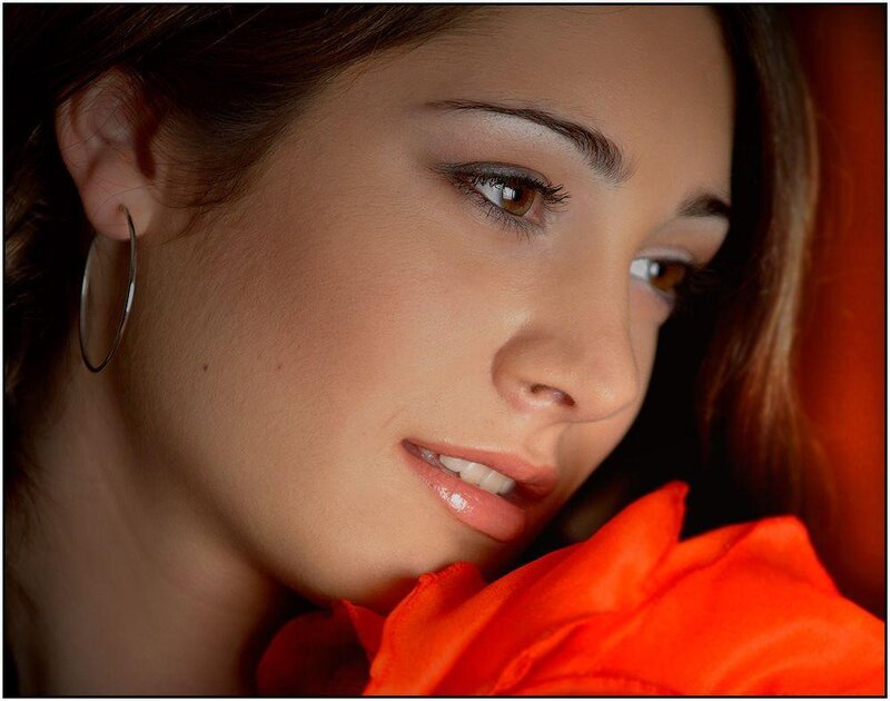 woman with orange rose