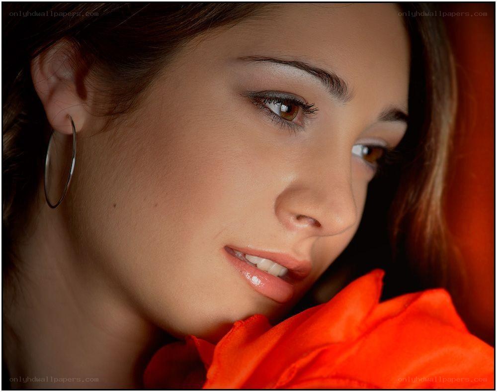 woman with orange rose