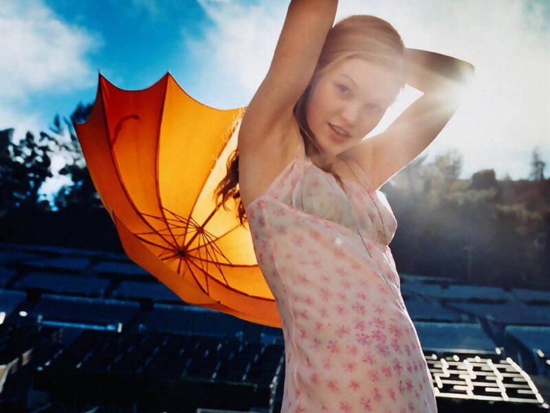 Woman with orange umbrella
