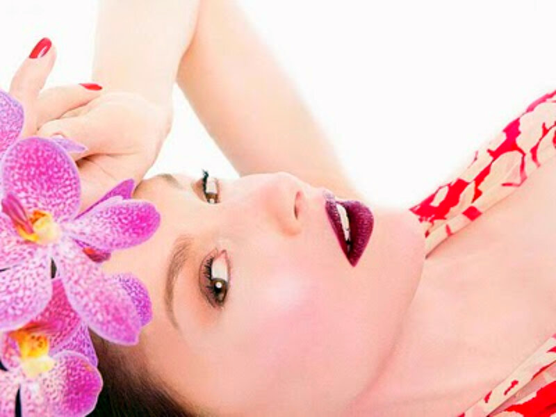 woman with orchid flower