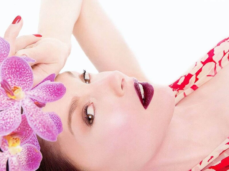 woman with orchid flower