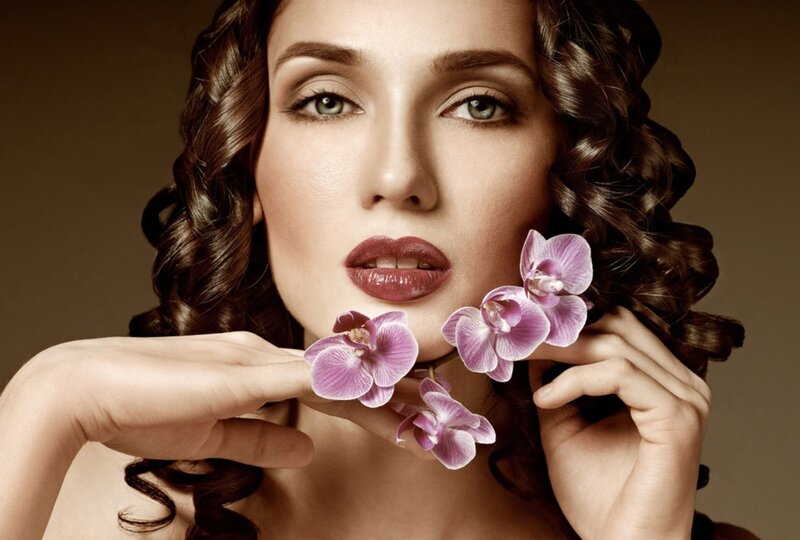 Woman with Orchid Flowers — Brown