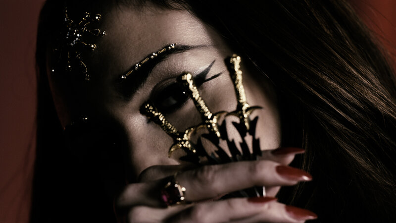 woman with ornate face jewelry