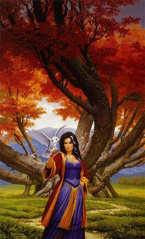 Woman with owl in autumn forest