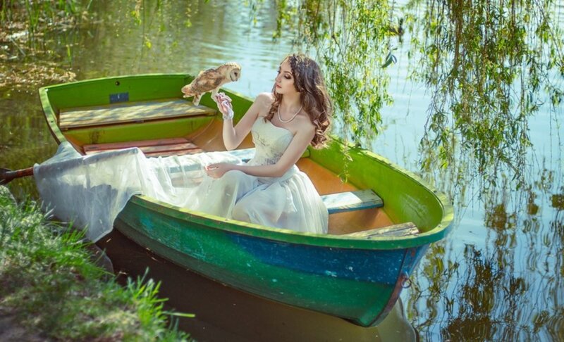 Woman with Owl in Boat