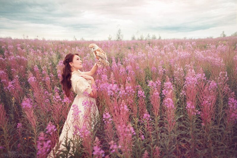 Woman with Owl in Field