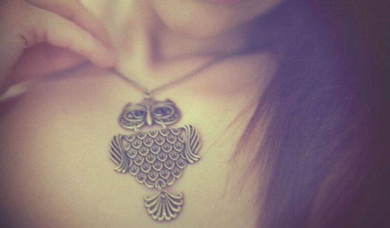 woman with owl pendant