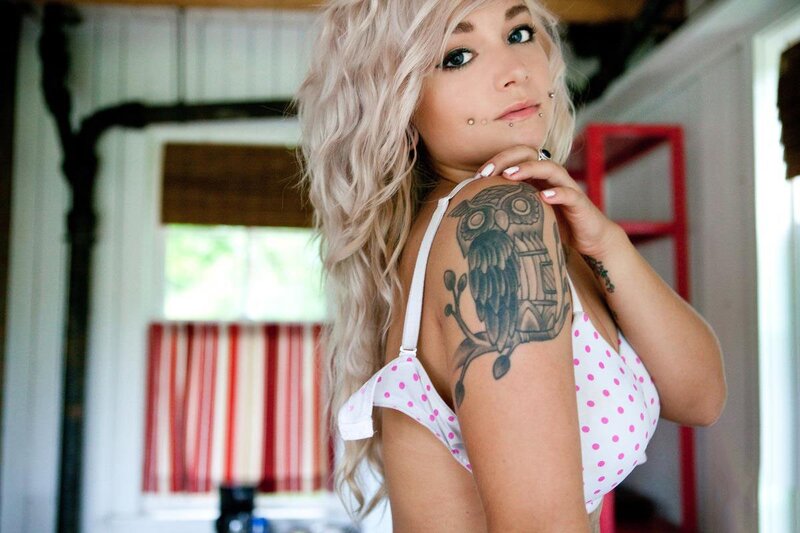 woman with owl tattoo