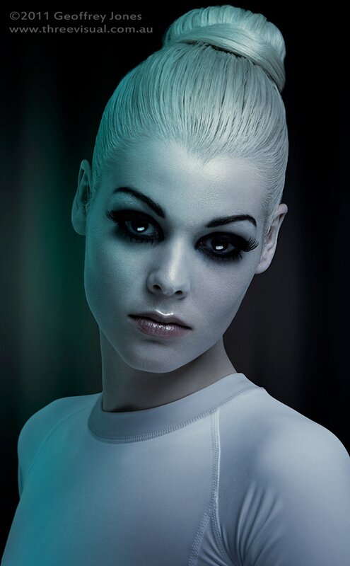 woman with pale makeup and blue lighting