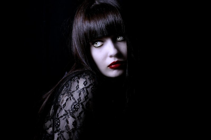 woman with pale makeup and red lips