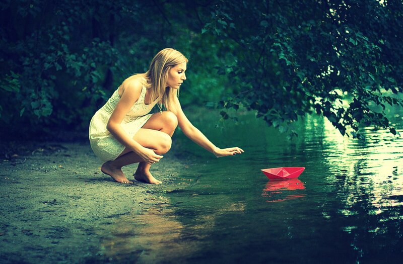Woman with Paper Boat