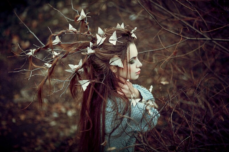 Woman with Paper Butterflies