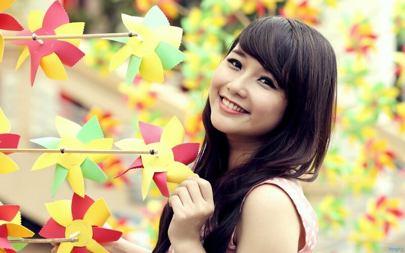 woman with paper windmills