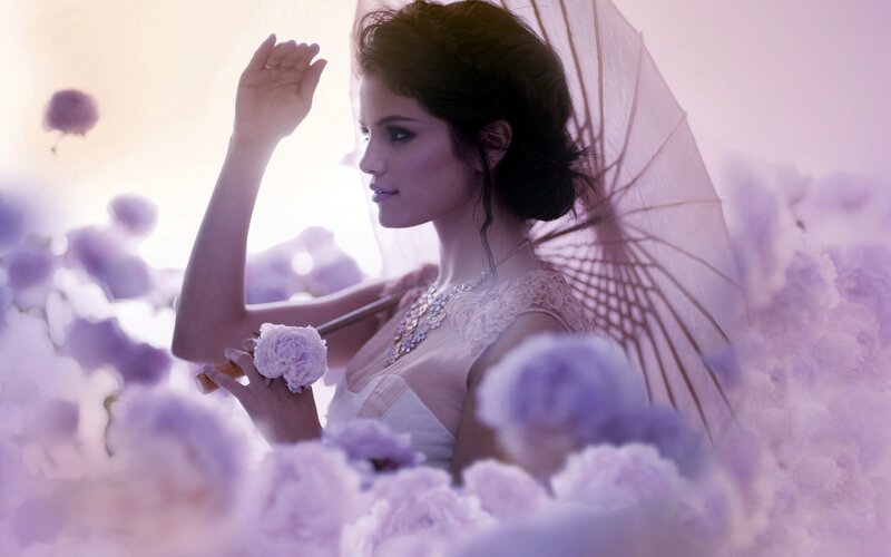 woman with parasol in flowers