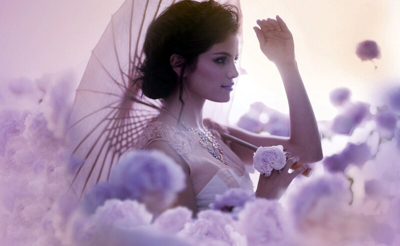 woman with parasol in flowers