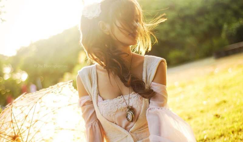 woman with parasol in sunlight