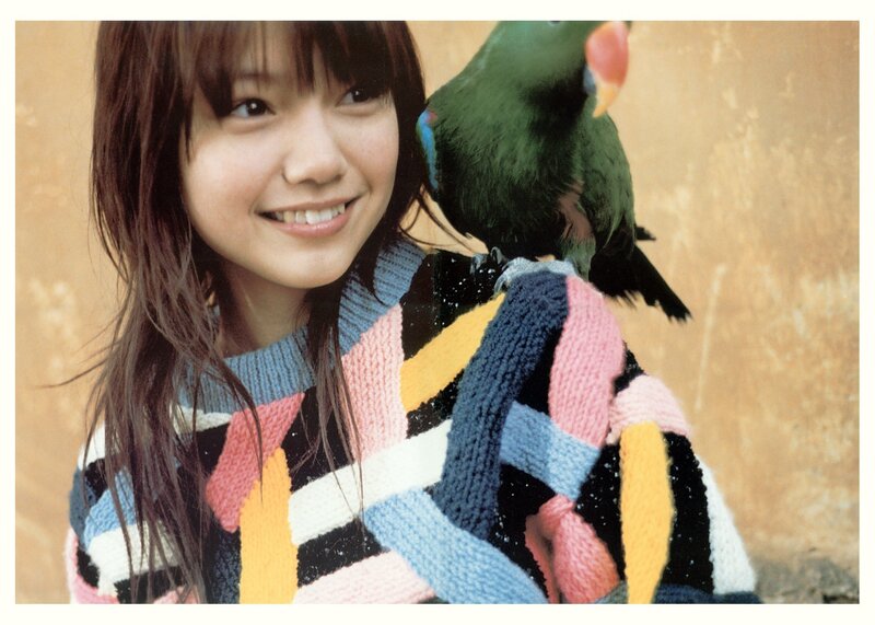 woman with parrot on shoulder