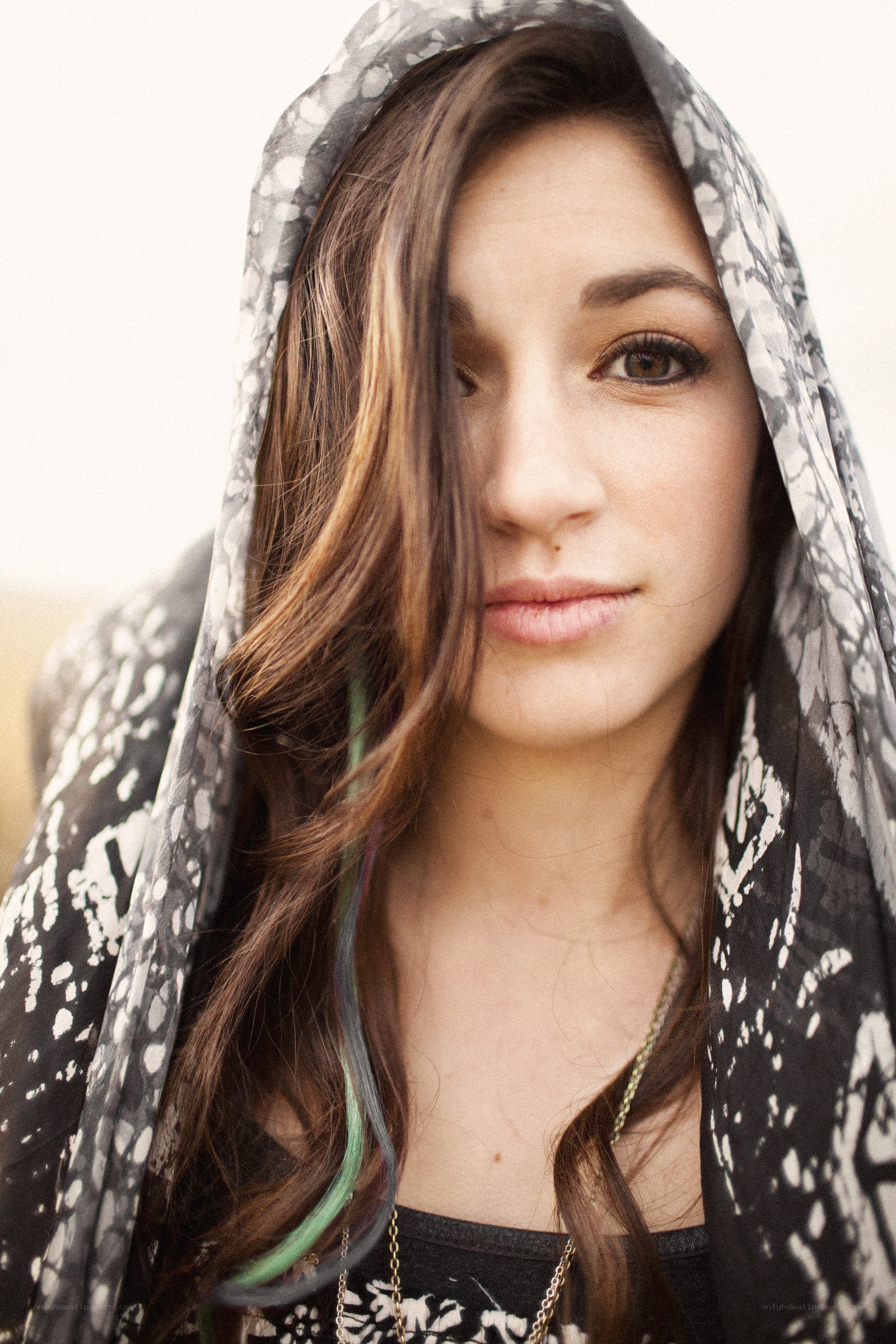woman with patterned hood