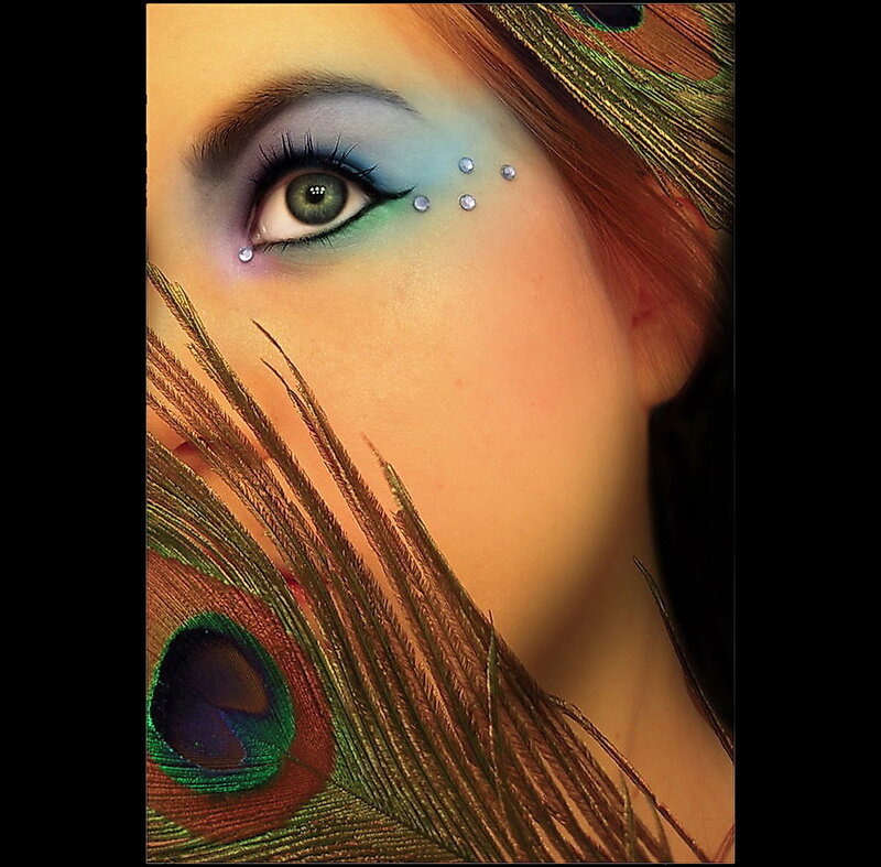 woman with peacock feather makeup